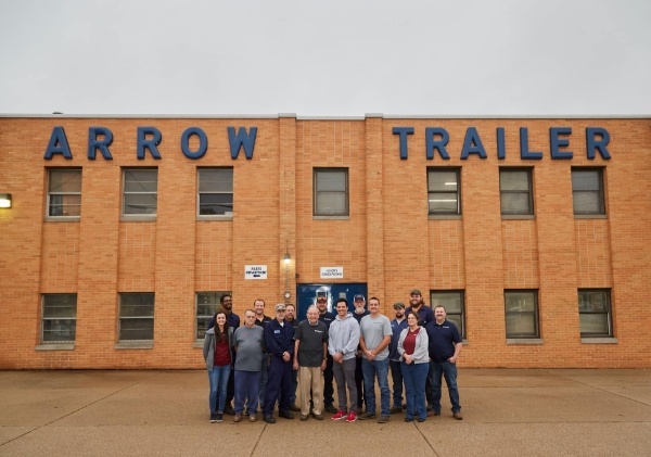 Employees outside Arrow Trailer & Equipment Co. - Selling trailers for sale in the Midwest.